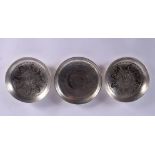 THREE CHINESE WHITE METAL DISHES 20th Century. 227 grams. 9.5 cm diameter. (3)