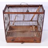 A Victorian wood and metal bird cage 38 x 36 x 27 cm.