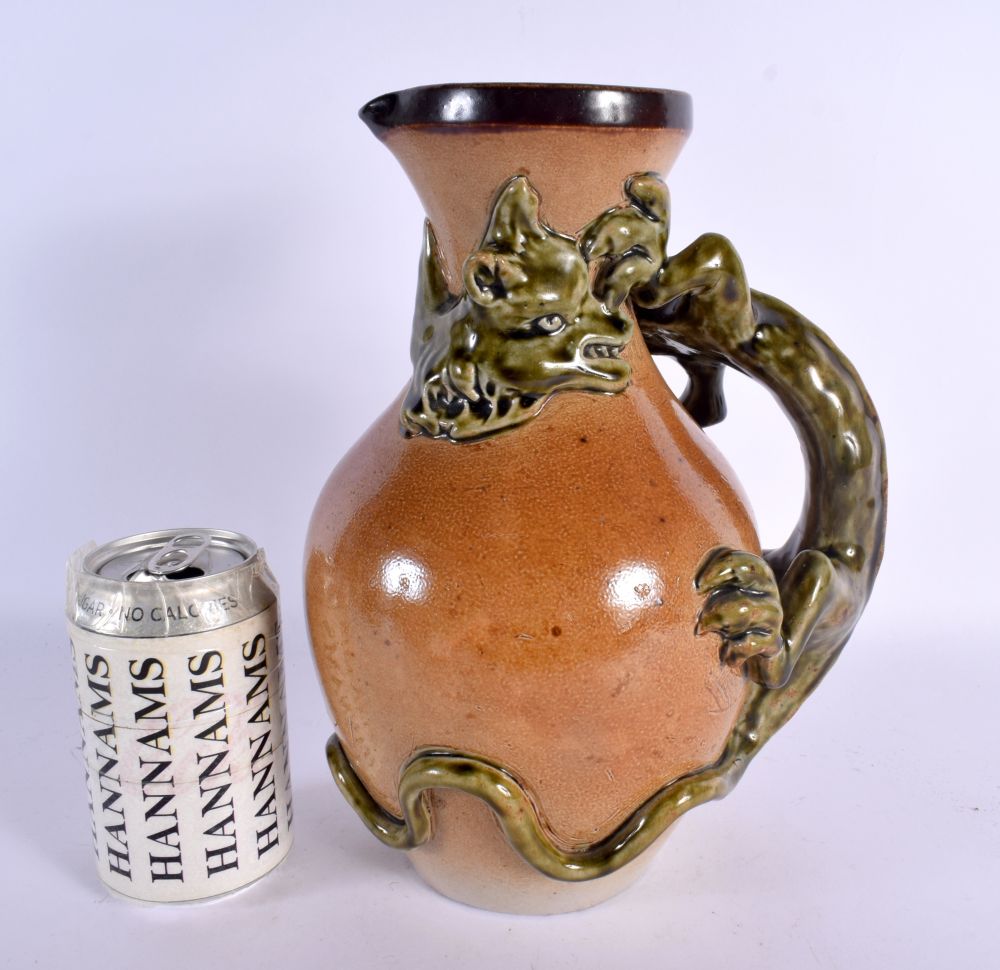 A LARGE ANTIQUE ENGLISH STONEWARE JUG in the manner of Martin Brothers. 27 cm x 15 cm.