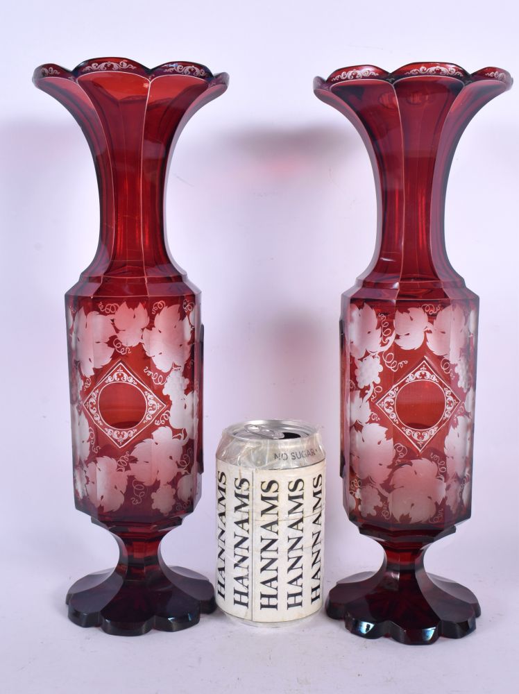 A PAIR OF LATE 19TH CENTURY BOHEMIAN CRANBERRY GLASS VASES engraved with The Great Exhibition Indust