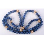 A CHINESE REPUBLICAN PERIOD GOLD AND LAPIS LAZULI NECKLACE. 88 grams. 76 cm long.