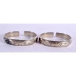 TWO CHINESE WHITE METAL BANGLES 20th Century. 108 grams. 7 cm wide. (2)
