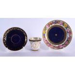 Early 19th century Sevres saucer shaped dish painted with a continuous band of flowers on a blue and