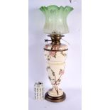 A LARGE ANTIQUE ENGLISH COUNTRY HOUSE POTTERY OIL LAMP decorated with foliage. 58 cm high.