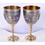 A PAIR OF 19TH CENTURY RUSSIAN SILVER NIELLO AND ENAMEL GOBLETS. 242 grams. 13 cm x 6.25 cm.