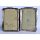 A PAIR OF STERLING SILVER PHOTOGRAPH FRAMES. 892 grams overall. 25 cm x 18 cm.