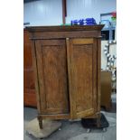 A large 18th Century Dutch carved wood linen cupboard, carved with fans in panels and a bamboo edgin