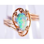 A 14CT GOLD OPAL AND DIAMOND RING. 3.2 grams. M.