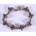 A SILVER AND AMETHYST BRACELET. 20 grams. 19 cm long.