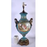 A LARGE 19TH CENTURY FRENCH SEVRES PORCELAIN TWIN HANDLED LAMP painted with figures. 54 cm x 20 cm.