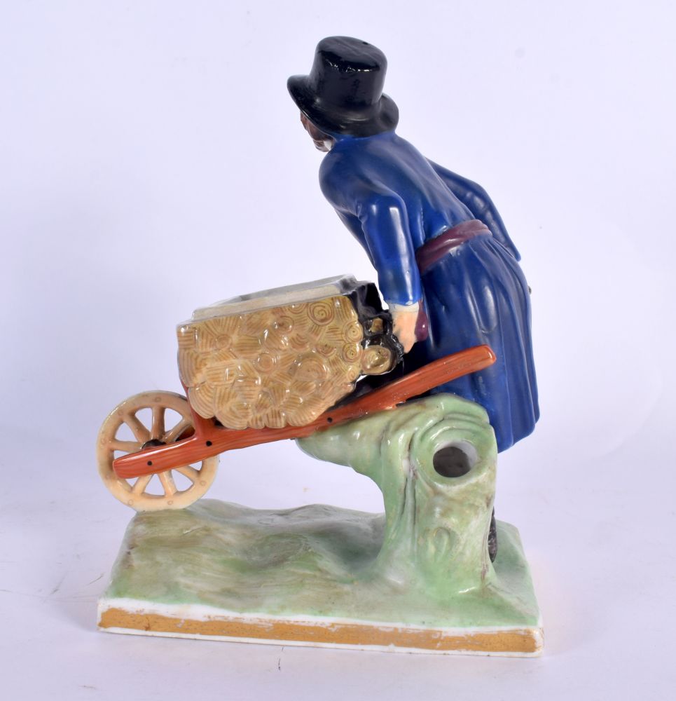 A RARE ANTIQUE RUSSIAN PORCELAIN FIGURE OF A MALE modelled holding a barrow upon a naturalistic base - Image 3 of 5