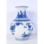 A Chinese porcelain blue and white vase decorated with fruit trees and leaf's 29cm.