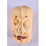 A JAPANESE BONE MASK NETSUKE. 5.5 cm x 3.5 cm.