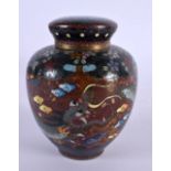 A 19TH CENTURY JAPANESE MEIJI PERIOD CLOISONNE ENAMEL JAR AND COVER decorated with dragons. 10 cm x