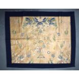 A 17TH CENTURY CHINESE PALE BROWN GLAZED EMBROIDERED SILK BROCADE PANEL Ming/Qing, depicting a drago