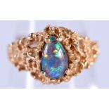 A 14CT GOLD AND OPAL RING. 4 grams. K/L.