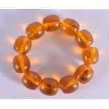 AN AMBER BRACELET. 4.5 cm internal width.