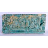 A 12TH / 13TH CENTURY PERSIAN KASHAN POTTERY TURQUOISE TILE with raised calligraphy central with a