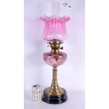 A LARGE LATE VICTORIAN PINK GLASS OIL LAMP painted with foliage and vines. 62 cm high overall.