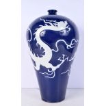 A Chinese porcelain MEIPING vase decorated in relief with a dragon 42 cm.