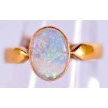 A GOOD 22CT GOLD AND OPAL RING. 3.9 grams. N.