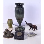 A Norwegian bronze vase together with a metal elephant, Easter Island stone head, D P Carter pig et