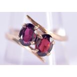 A 9CT GOLD DOUBLE RUBY RING. 2.9 grams. Q.