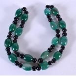 A JADE NECKLACE. 56cm long, largest bead13.1mm, weight 94g