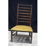 An antique low ladder back chair 86 x 49x 41 cm.