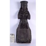 A LARGE 18TH/19TH CENTURY EUROPEAN CARVED WOOD FIGURE OF A SAINT modelled seated upon a stump. 52 cm