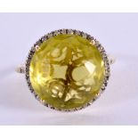 A 14CT GOLD DIAMOND AND PERIDOT RING. 5.2 grams. T.