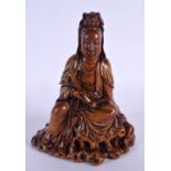 AN EARLY 20TH CENTURY CHINESE CARVED WOOD FIGURE OF AN IMMORTAL Late Qing/Republic, modelled holding