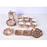 A collection of Royal Crown Derby coffee pot, cups, saucers etc (Qty).