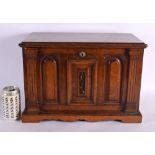 A LOVELY LATE VICTORIAN GENTLEMAN'S OAK DESK CABINET the top rising, to reveal a fall front with pop