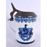 A RARE GERMAN MEISSEN COMMEMORATIVE TANKARD painted with armorials. 19 cm high.