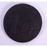 Walkers rare black basalt medallion plaque depicting classical figures, inscribed 'Clementia Augus