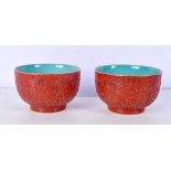 A small pair of Chinese porcelain tea bowls decorated in relief with foliage 5 x 8 cm.