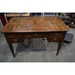 An Italian walnut veneered 5 drawer desk 83 x 129 x 76 cm .