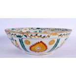 A TURKISH OTTOMAN KUTAHYA POTTERY BOWL painted with flowers. 21 cm diameter.