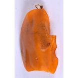 A LARGE AMBER TYPE PENDANT. 8.3cm x 4.4cm, weight 27.7g