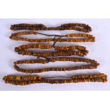 FIVE MIDDLE EASTERN CARVED AMBER PRAYER BEAD NECKLACES. 617 grams. 64 cm long. (5)