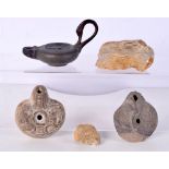 A small bronze oil lamp together with two early stone oil lamps and fossil samples largest 12.5cm (5