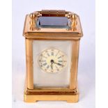 A CONTINENTAL MINIATURE CARRIAGE CLOCK. 6.5 cm high inc handle.