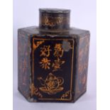 A RARE CHINESE QING DYNASTY BLACK LACQUERED PAINTED TIN CADDY AND COVER decorated with calligraphy.