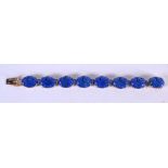 A 14CT GOLD AND LAPIS BRACELET. Stamped 14K, length 18cm, weight 32.4g