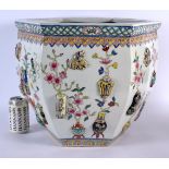 A LARGE CHINESE REPUBLICAN PERIOD FAMILLE ROSE PRECIOUS OBJECTS JARDINIERE decorated in relief with