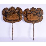 A PAIR OF REGENCY COUNTRY HOUSE PEN WORK LACQUER FANS depicting figures in landscapes. 21 cm x 38 cm