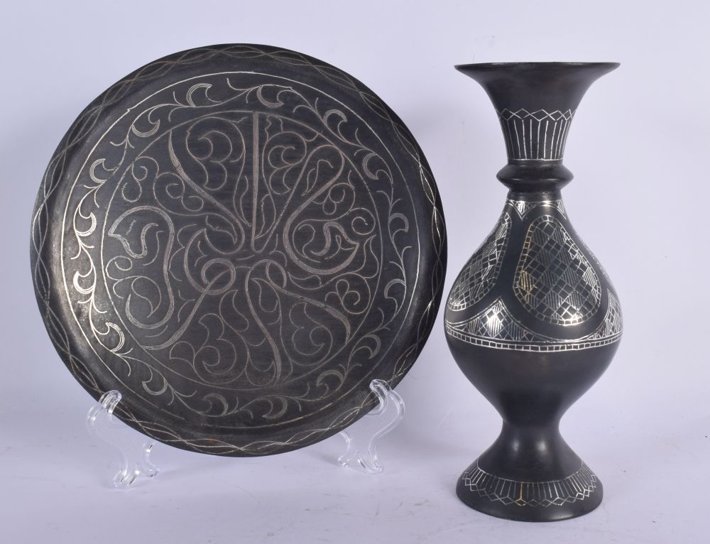 A 19TH CENTURY MIDDLE EASTERN SILVER INLAID BRONZE VASE together with a similar silver inlaid dish.