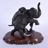 A 19TH CENTURY JAPANESE MEIJI PERIOD BRONZE OKIMONO modelled as an elephant. 15 cm x 18 cm.