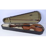 A cased violin together with a bow .
